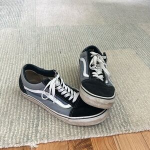 Black and blue vans skate shoes. shoe with a classic look